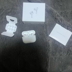Apple White Wireless Earbuds with Charging Case and Accessories